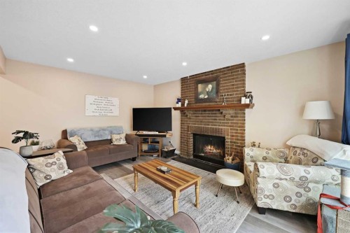 100 Hawkfield Crescent Nw, Calgary, AB - Indoor Photo Showing Living Room With Fireplace
