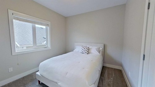 130 Riverwood Crescent Sw, Diamond Valley, AB - Indoor Photo Showing Bedroom