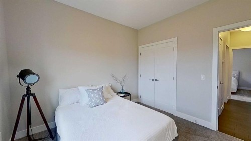 130 Riverwood Crescent Sw, Diamond Valley, AB - Indoor Photo Showing Bedroom