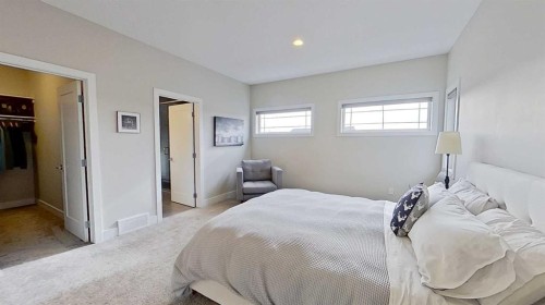 130 Riverwood Crescent Sw, Diamond Valley, AB - Indoor Photo Showing Bedroom