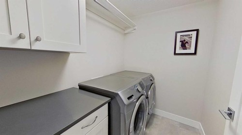 130 Riverwood Crescent Sw, Diamond Valley, AB - Indoor Photo Showing Laundry Room