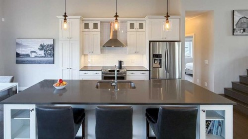 130 Riverwood Crescent Sw, Diamond Valley, AB - Indoor Photo Showing Kitchen With Stainless Steel Kitchen With Double Sink With Upgraded Kitchen