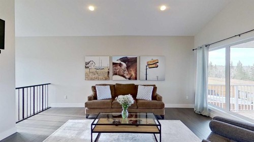 130 Riverwood Crescent Sw, Diamond Valley, AB - Indoor Photo Showing Living Room