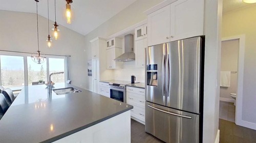 130 Riverwood Crescent Sw, Diamond Valley, AB - Indoor Photo Showing Kitchen With Stainless Steel Kitchen With Double Sink With Upgraded Kitchen