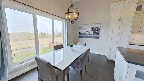 130 Riverwood Crescent Sw, Diamond Valley, AB - Indoor Photo Showing Dining Room