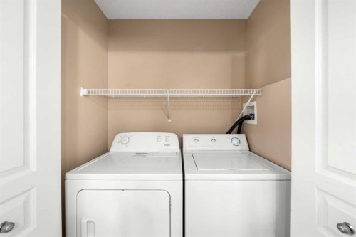 70 Crystal Shores Cove, Okotoks, AB - Indoor Photo Showing Laundry Room