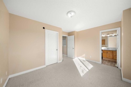 70 Crystal Shores Cove, Okotoks, AB - Indoor Photo Showing Other Room