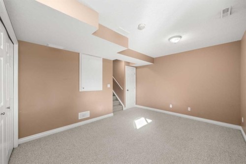 70 Crystal Shores Cove, Okotoks, AB - Indoor Photo Showing Other Room