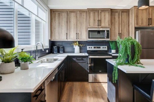 156 Crimson Ridge Place Nw, Calgary, AB - Indoor Photo Showing Kitchen With Stainless Steel Kitchen With Double Sink With Upgraded Kitchen