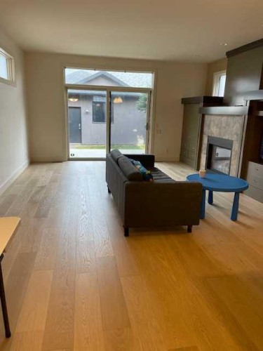 1604 18 Avenue Nw, Calgary, AB - Indoor Photo Showing Living Room With Fireplace