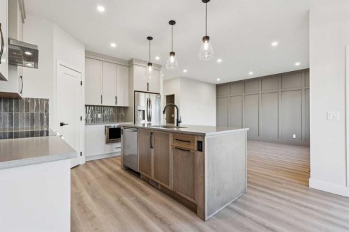 120 Quartz Crescent, Cochrane, AB - Indoor Photo Showing Kitchen With Upgraded Kitchen