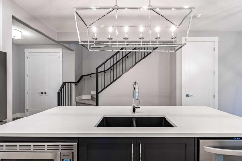 925 Reynolds Lane Sw, Airdrie, AB - Indoor Photo Showing Kitchen With Double Sink