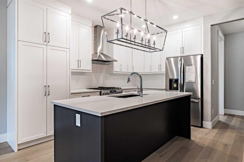 925 Reynolds Lane Sw, Airdrie, AB - Indoor Photo Showing Kitchen With Upgraded Kitchen