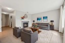 15 Sherwood Gate Nw, Calgary, AB  - Indoor Photo Showing Living Room With Fireplace 
