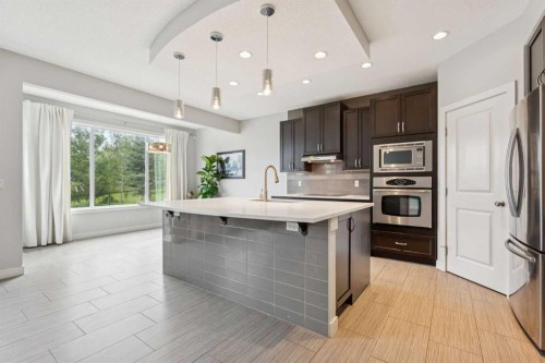 15 Sherwood Gate Nw, Calgary, AB - Indoor Photo Showing Kitchen With Upgraded Kitchen