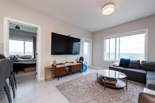 202-24 Sage Hill Terrace Nw, Calgary, AB - Indoor Photo Showing Living Room