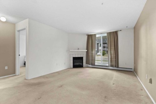 2113-2113 Tuscarora Manor Nw, Calgary, AB - Indoor With Fireplace