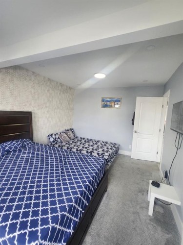 1028 Taradale Drive Ne, Calgary, AB - Indoor Photo Showing Bedroom