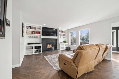 296 Lakeside Greens Crescent, Chestermere, AB - Indoor Photo Showing Living Room With Fireplace