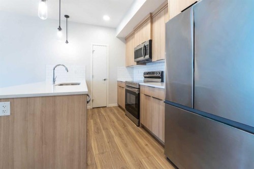 327-360 Harvest Hills Way Ne, Calgary, AB - Indoor Photo Showing Kitchen With Stainless Steel Kitchen