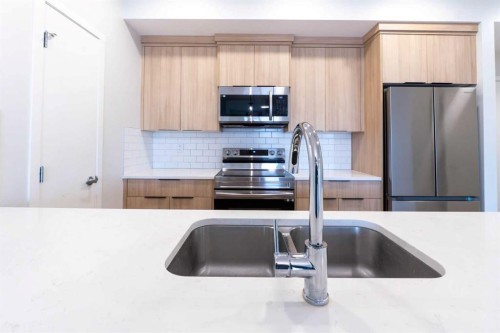 327-360 Harvest Hills Way Ne, Calgary, AB - Indoor Photo Showing Kitchen With Double Sink