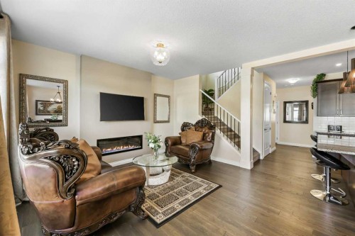 340 Lawthorn Way Se, Airdrie, AB - Indoor Photo Showing Living Room With Fireplace