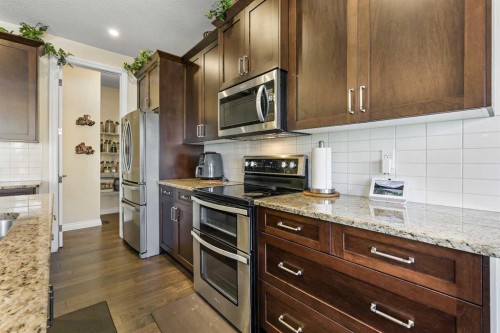 340 Lawthorn Way Se, Airdrie, AB - Indoor Photo Showing Kitchen With Upgraded Kitchen