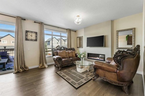 340 Lawthorn Way Se, Airdrie, AB - Indoor Photo Showing Living Room With Fireplace