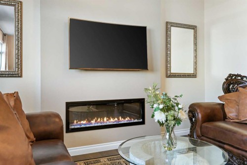 340 Lawthorn Way Se, Airdrie, AB - Indoor Photo Showing Living Room With Fireplace