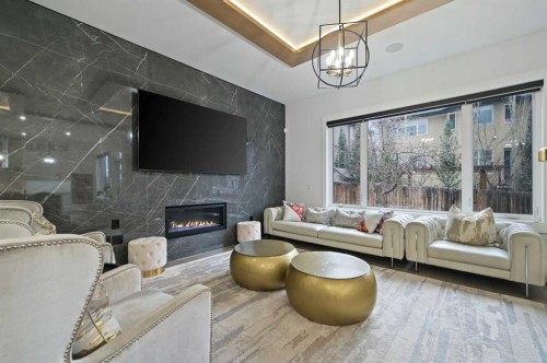 7250 Elkton Drive Sw, Calgary, AB - Indoor Photo Showing Living Room With Fireplace