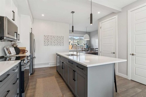 377 Sundown Road, Cochrane, AB - Indoor Photo Showing Kitchen With Upgraded Kitchen