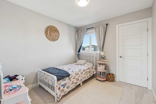 377 Sundown Road, Cochrane, AB - Indoor Photo Showing Bedroom