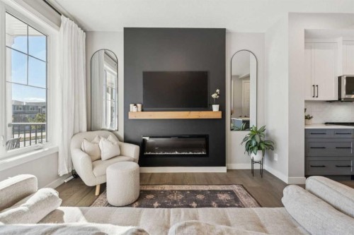 377 Sundown Road, Cochrane, AB - Indoor Photo Showing Living Room With Fireplace