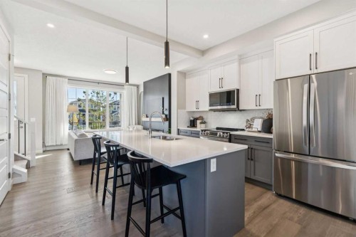 377 Sundown Road, Cochrane, AB - Indoor Photo Showing Kitchen With Double Sink With Upgraded Kitchen