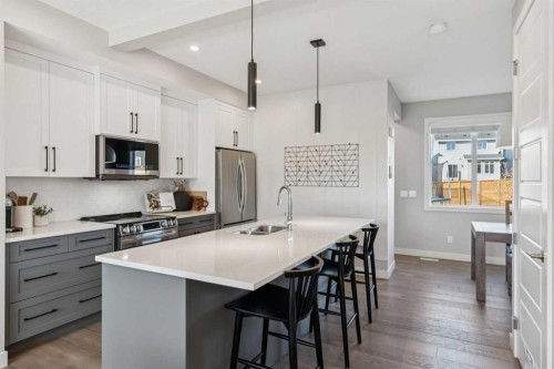 377 Sundown Road, Cochrane, AB - Indoor Photo Showing Kitchen With Double Sink With Upgraded Kitchen
