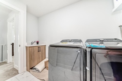 127 Saddlecrest Grove Ne, Calgary, AB - Indoor Photo Showing Laundry Room