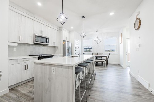 112 Midtown Close Sw, Airdrie, AB - Indoor Photo Showing Kitchen With Stainless Steel Kitchen With Upgraded Kitchen