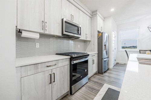 112 Midtown Close Sw, Airdrie, AB - Indoor Photo Showing Kitchen With Stainless Steel Kitchen With Upgraded Kitchen