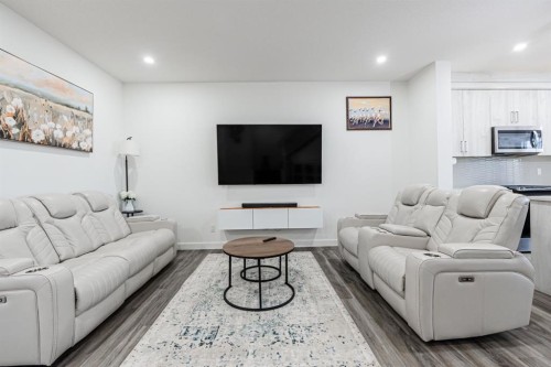 112 Midtown Close Sw, Airdrie, AB - Indoor Photo Showing Living Room