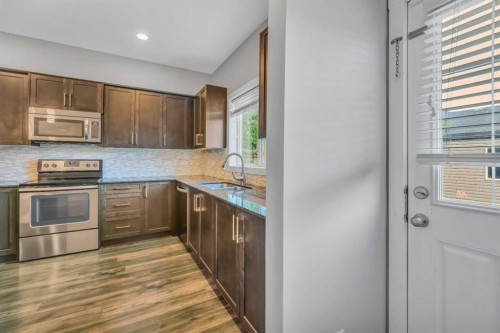 315 Hillcrest Drive Sw, Airdrie, AB - Indoor Photo Showing Kitchen With Stainless Steel Kitchen