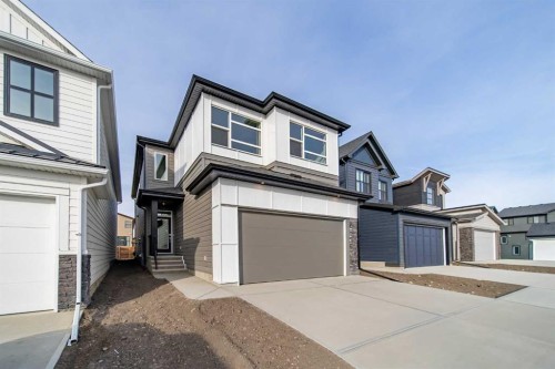 73 Royston Grove Nw, Calgary, AB - Outdoor With Facade