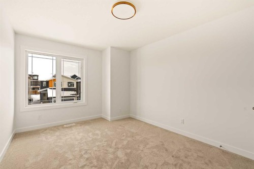 529 Lucas Way Nw, Calgary, AB - Indoor Photo Showing Other Room