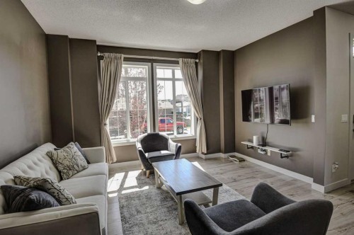 78 Marquis Heights Se, Calgary, AB - Indoor Photo Showing Living Room