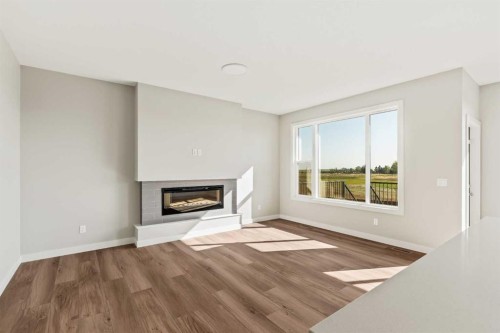 163 Belvedere Crescent, Calgary, AB - Indoor Photo Showing Living Room With Fireplace