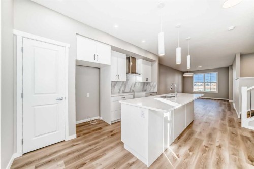 1168 Mahogany Boulevard Se, Calgary, AB - Indoor Photo Showing Kitchen With Fireplace