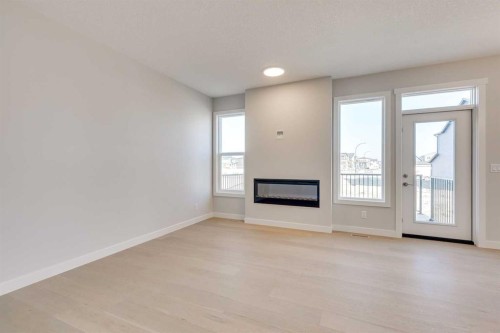 157 Wolf Hollow Drive Se, Calgary, AB - Indoor Photo Showing Living Room With Fireplace