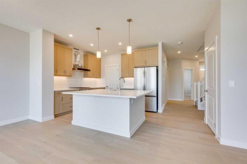 157 Wolf Hollow Drive Se, Calgary, AB - Indoor Photo Showing Kitchen With Upgraded Kitchen