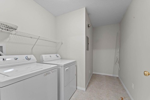 109-4507 45 Street Sw, Calgary, AB - Indoor Photo Showing Laundry Room