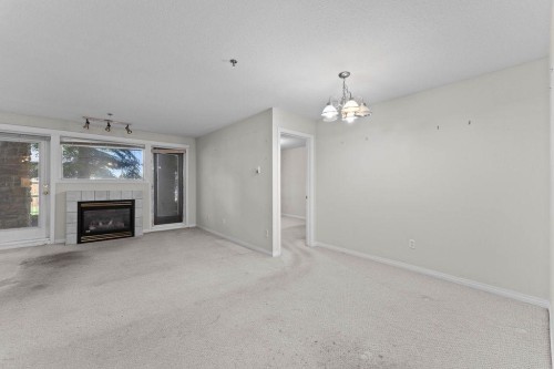 109-4507 45 Street Sw, Calgary, AB - Indoor With Fireplace