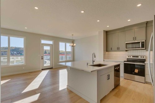 143 Creekstone Green Sw, Calgary, AB - Indoor Photo Showing Kitchen With Upgraded Kitchen